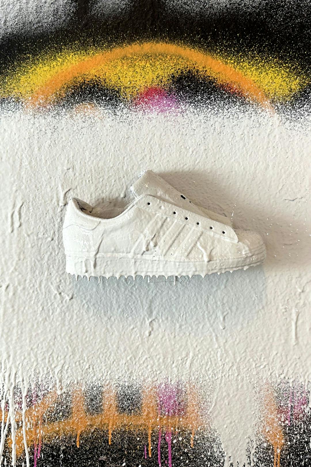 Shoe painted all white to conceal illustrations.